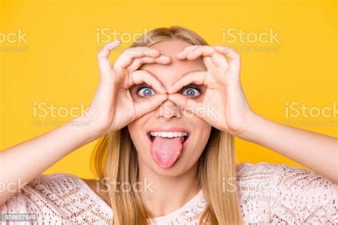 Head Shot Close Up Portrait Of Foolish Playful Girl Gesturing Tongueout
