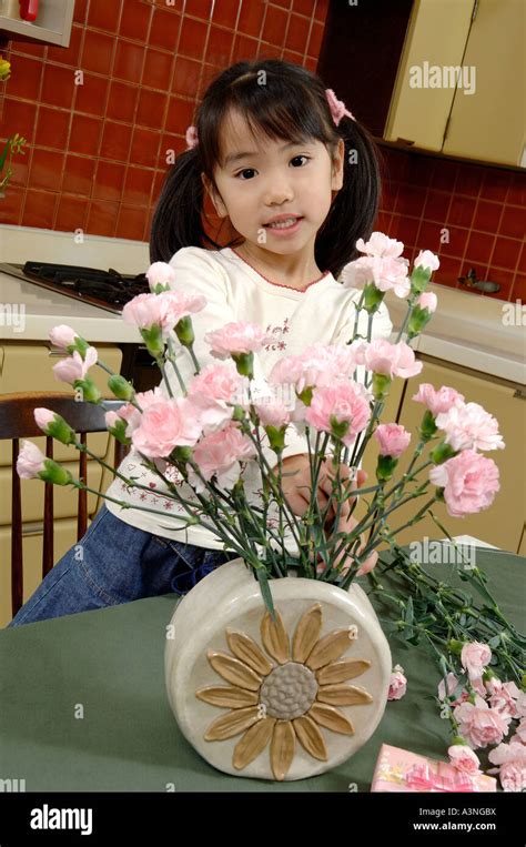 Girl Arranging Carnation On Mother S Day Stock Photo Alamy