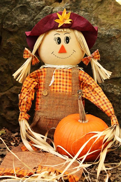 Scarecrow Holding Pumpkin Free Stock Photo Public Domain Pictures