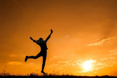 Happy Woman Jumping And Sunset Silhouette Stock Photo Image Of Action
