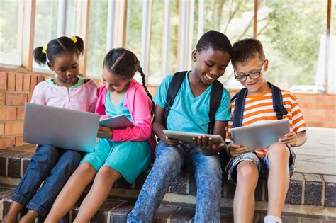 Elementary Students Bring District Issued Devices For First Day of In