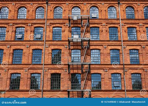Red Brick Classic Industrial Building Facade With Multiple Windows