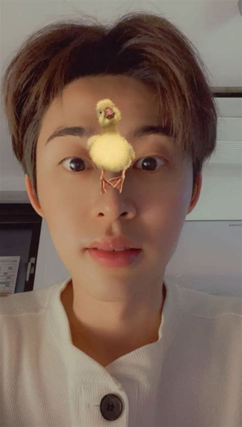 A Man With A Fake Duck On His Forehead