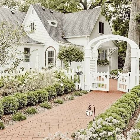Cute White Cottage With Archway And Gate Cottage Dream House