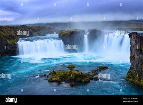 Godafoss Waterfall With Glowing Turquoise And White Spray In Iceland