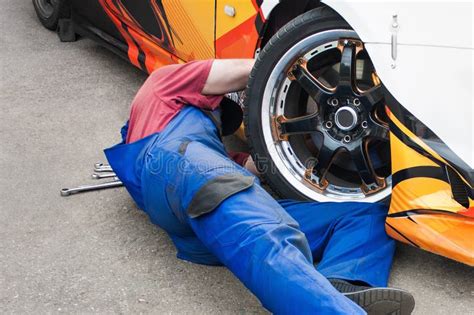 Auto Mechanic Repairing A Car Stock Photo Image Of Maintenance Blue