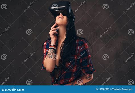 Tattooed Girl Wearing A Red Unbuttoned Checked Shirt Wearing A Vr