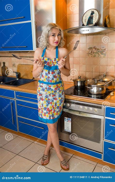 Attractive Naked Blond Housewife In An Apron Alone In A Home Kitchen Stock Image Image Of