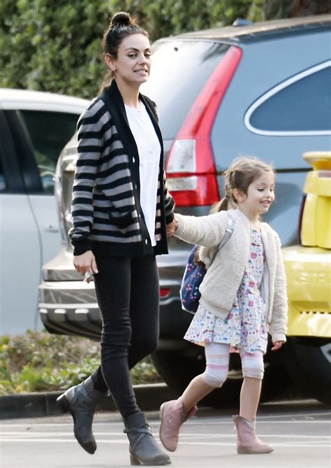 mila kunis and daughter wyatt hold hands while out