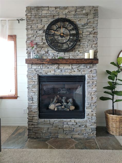 After a few weekends of work, we finally installed the last piece of stone and jumped for joy that this project was officially finished! Stacked Stone Fireplace Remodel | Brick fireplace makeover ...