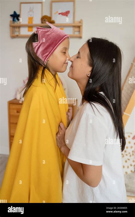 Mother And Daughter Rubbing Noses At Home Stock Photo Alamy