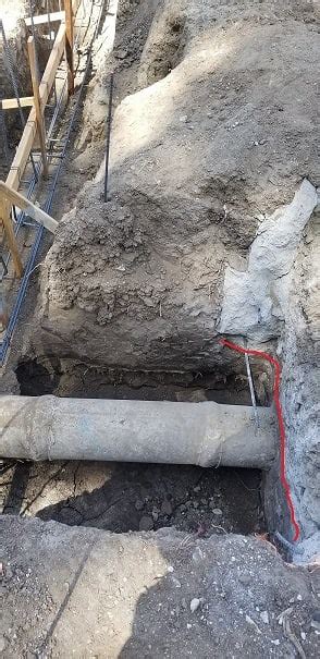 Existing Concrete Pipe Through New Pier Footing Foundation