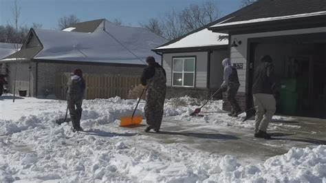 Teens Work Together To Shovel Snow Off Driveways