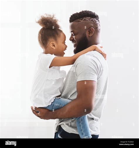 Dad Hugging His Little Daughter At Home Stock Photo Alamy