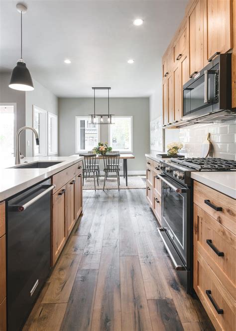 The high variation in the grain and knot pattern of acacia. Contemporary Kitchen with Natural Wood Cabinets | HGTV