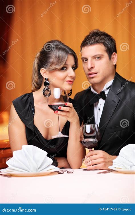 Classy Couple Sitting At A Table In A Restaurant Stock Image Image Of