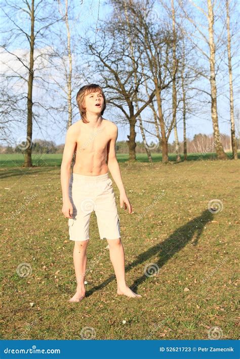 Barefoot Boy Standing On Grass Stock Image 52621723
