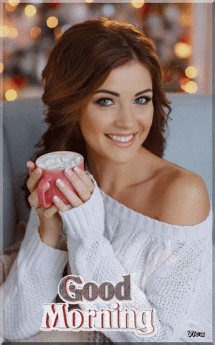A Woman Is Holding A Cup And Smiling