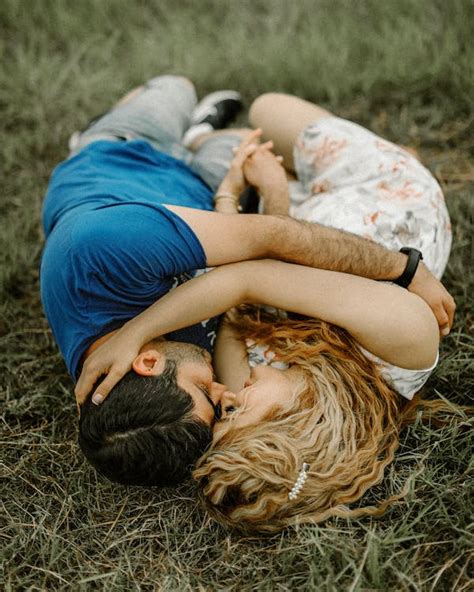 Photo Of Couple Lying On Grass Field · Free Stock Photo