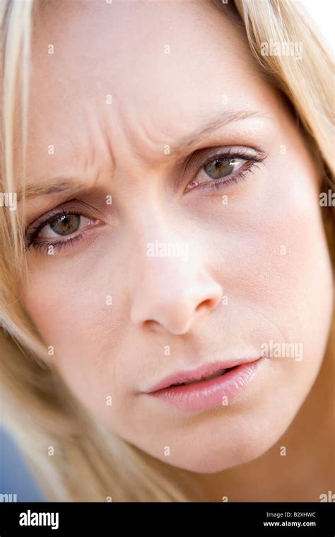 Head Shot Of Woman Scowling Stock Photo Alamy