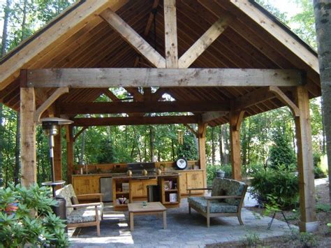 A timber frame attached pergola over a porch can also easily create a wonderful extension of a kitchen as well as eating and dining room spaces better suited for socializing. This is the kind of rough hewn timber frame pavilion I ...