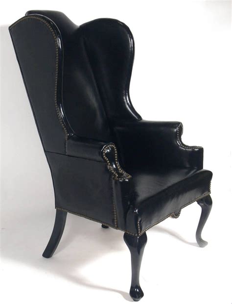 To protect the back and side of the user of the chair from a cold draft. Perfectly Patinated Black Leather Wing Chair For Sale at ...