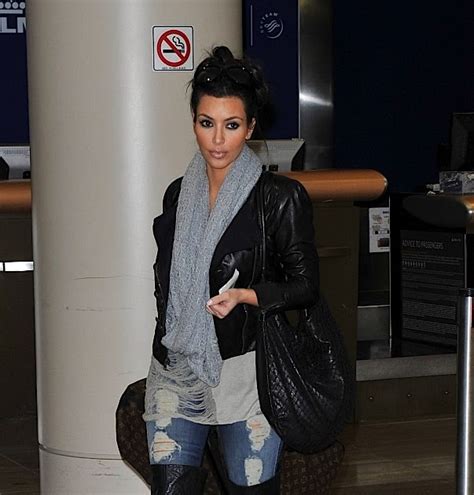Kim Kardashian Looks Totally Glam At The Airport With Louis Vuitton