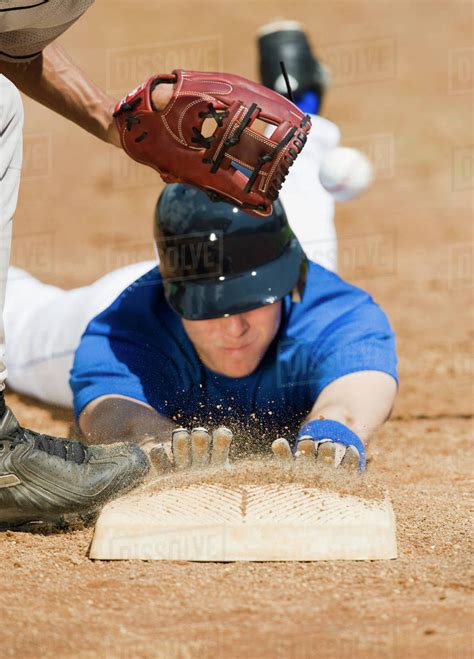Baseball Player Sliding Into Home Base Stock Photo Dissolve