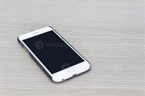 Smart Phone With Blank Screen Lying On Gray Wooden Table 3089018 Stock