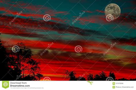 A Partially Full Moon During A Beautiful Sunset Stock Photo Image Of