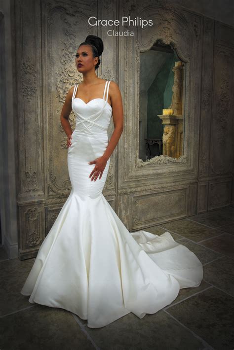 Long sleeve satin wedding dresses. A satin fit n flare fishtail wedding dress with wrap over ...