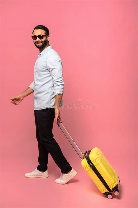 Full Length View Of The Smiling Positive Indian Man Carrying Luggage