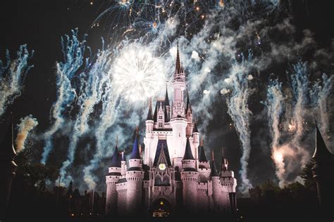 Download Pink Disneyland Castle And Fireworks Wallpaper