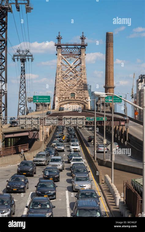 Queensboro Bridge View In Summer Of Traffic On The Manhattan Side Of