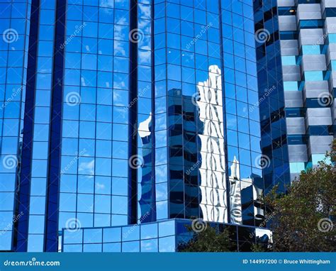 Blue Sky And Building Reflections On Glass Windows Stock Photo Image Of Distorted Pattern