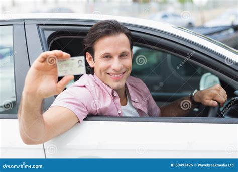 Man Smiling And Holding His Driving License Stock Photo Image Of