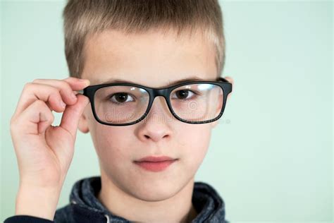 Close Up Portrait Of A Child School Boy Wearing Glasses Stock Photo