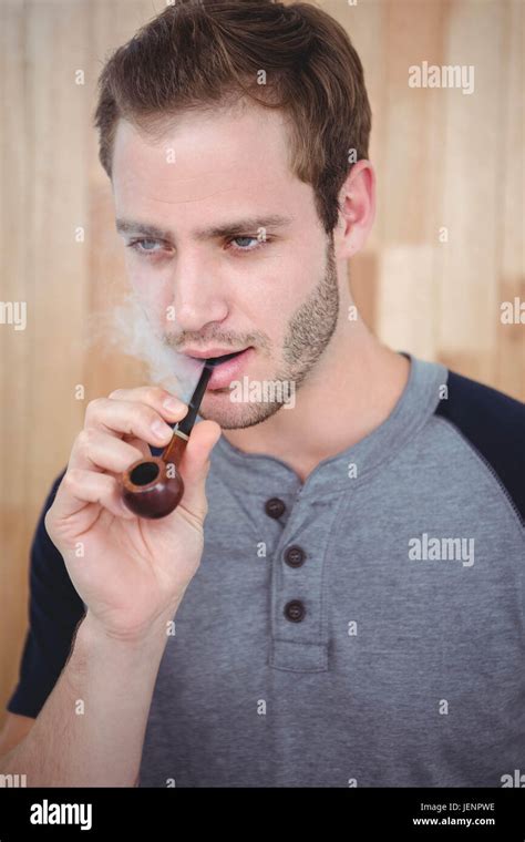 Handsome Hipster Smoking Pipe Stock Photo Alamy