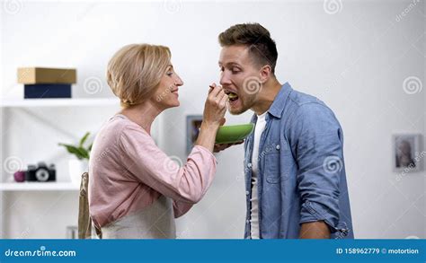 Overprotective Mother Feeding Adult Son With Spoon Toxic Relationship