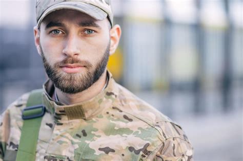 Premium Photo Portrait Of A Sad Desperate Young Military Man Looking