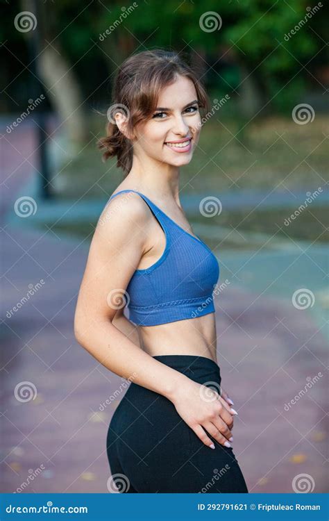 Sporty Young Woman In Sportswear Doing Stretching Exercises Outdoors Stock Image Image Of