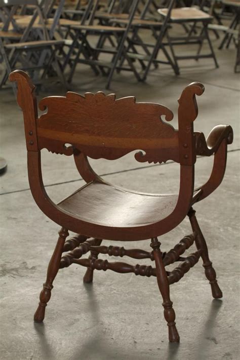 Up for auction is a beautifully crafted all wood antique chair with carving on round seat turned wood in really good vintage condition very sturdy just a well made probably one of a kind chair. Antique Chair with Carved Face.