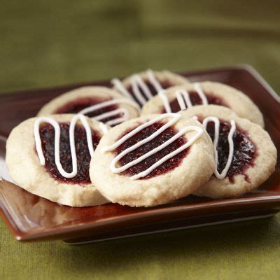 Spoon 1 tsp of jam onto each cookie bottom. Austrian Jam Print Cookies from Through the Country Door