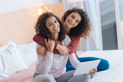 Mulatto Sisters Are Sitting Back To Back Playing Stock Image Image Of Green Concept 73541877