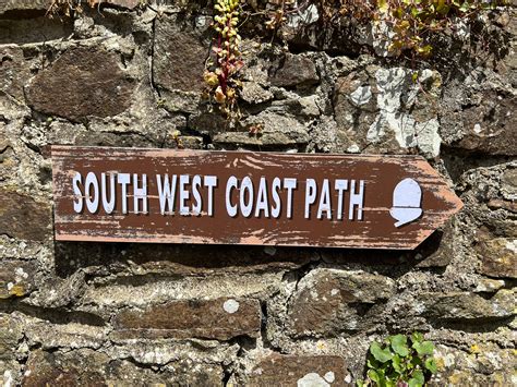 South West Coast Path Direction Arrow In An Earthy Brown With The