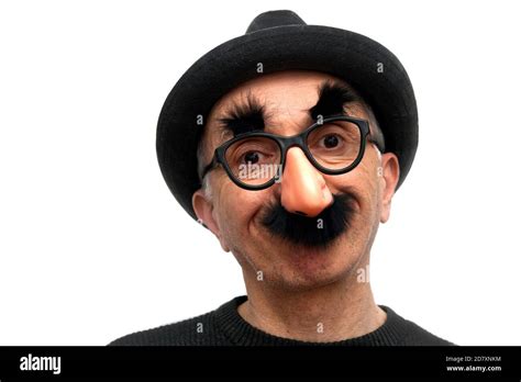 Man With Trilby Hat And Funny Mask With Fake Moustaches Glasses And A