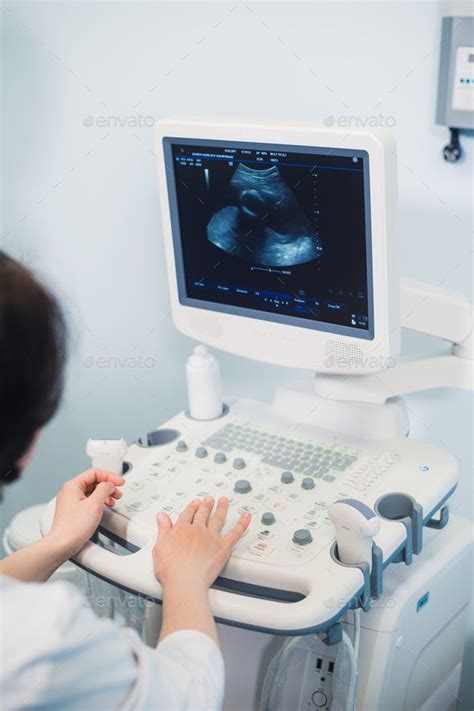 Skillful Sonographer Using Ultrasound Machine At Work Ultrasound
