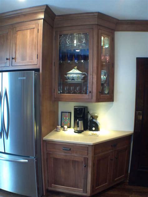 Glass kitchen cabinet doors can add depth and dimension to your kitchen space, thomas explains. Dark stained inset kitchen cabinet with glass doors ...