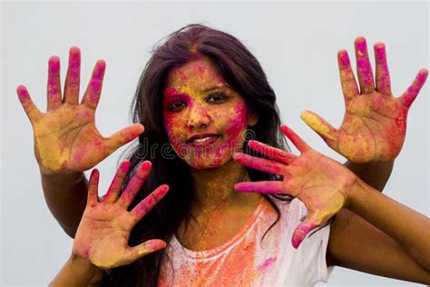 Indian Girl Showing Her Colourful Hands Printing Or Playing Holi Festival With Colours Isolated