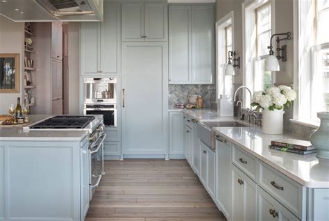 Dainty, pastel colors and pale shades of blue blend well with a white wall backdrop. Design Trend: Blue Kitchen Cabinets & 30 Ideas to Get You ...